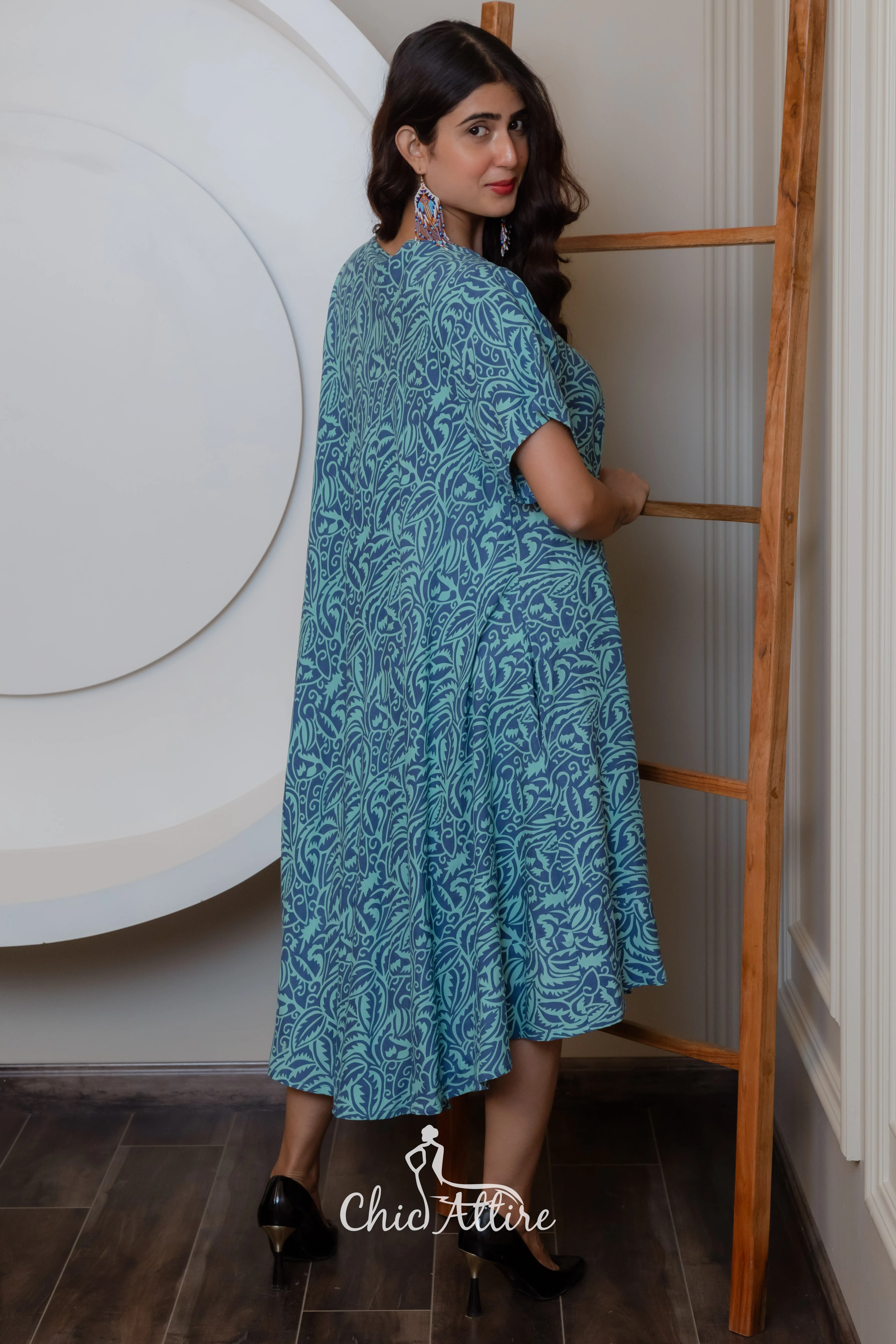 Stylish Teal White Swirl Pattern Midi Dress Ruffled Hemline Short Sleeves Neckline Comfortable Light Flowy Fabric Casual Summer