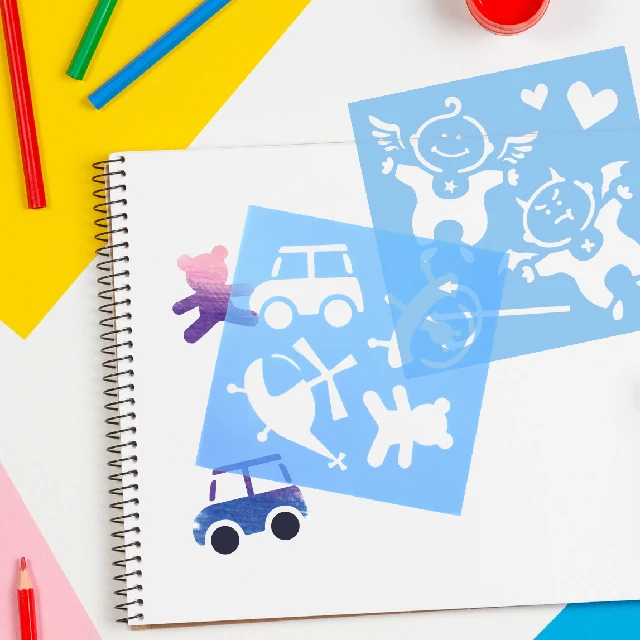 Kids drawing plastic stencil for DIY painting scrapbooking