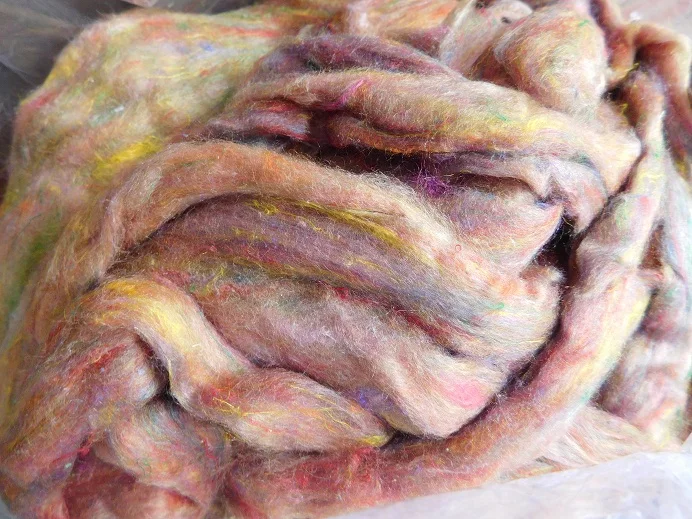 custom made bright green colored sari silk sliver made from the finest mulberry silk roving ideal for textile spinners