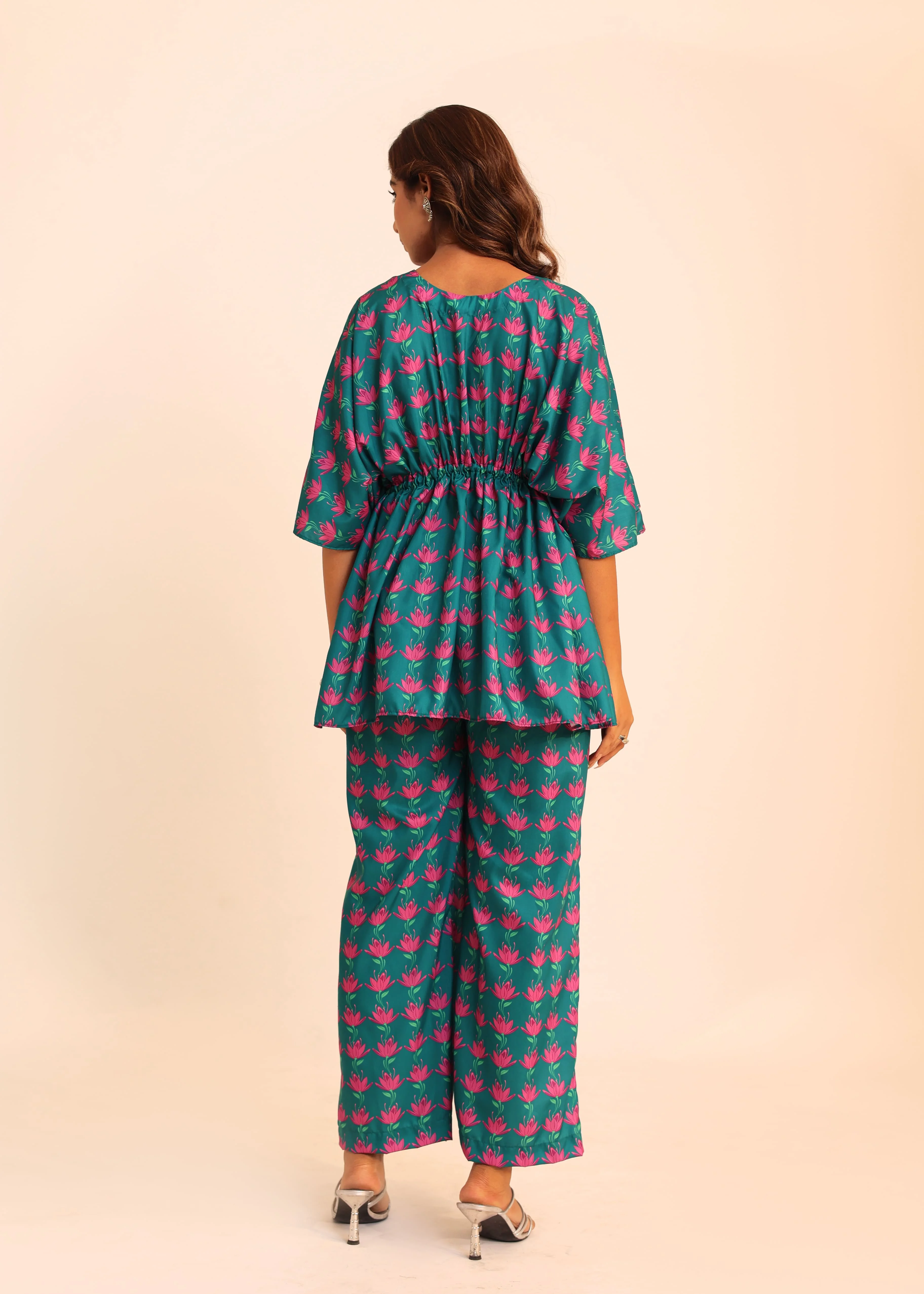 The Meticulously Designed Top And Pant Combination Complete With A Stylish Waist Tie, Offers A Perfect Blend Of Fashion