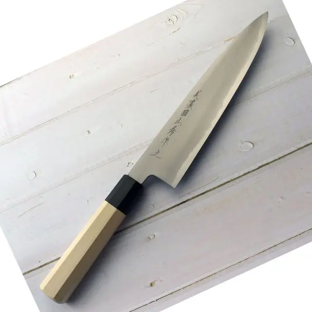 Gyuto Knife double edge blade Japanese knife crafted by a skilled blacksmith using an ancient Japanese manufacturing method