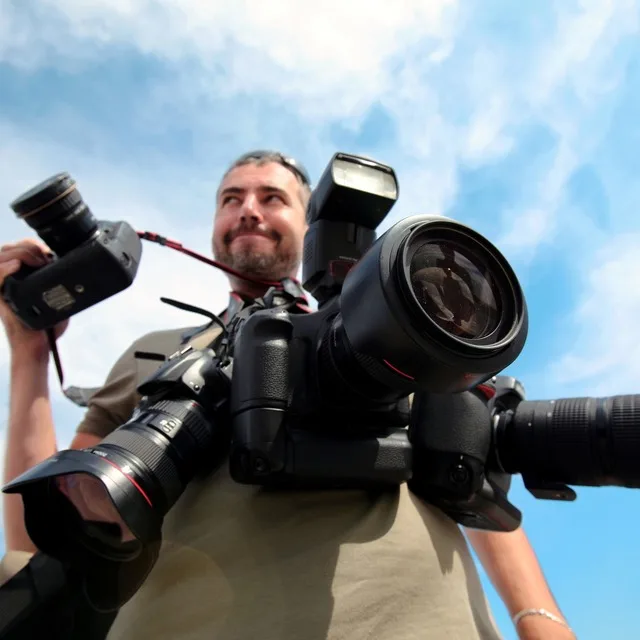 Cool photographer and videographer on a business tour a bright event in Russia, the best price