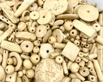 hand carved bone beads in assorted sizes with holes for jewelry designers and bead stores Buffalo Camel Ox Bone Beads