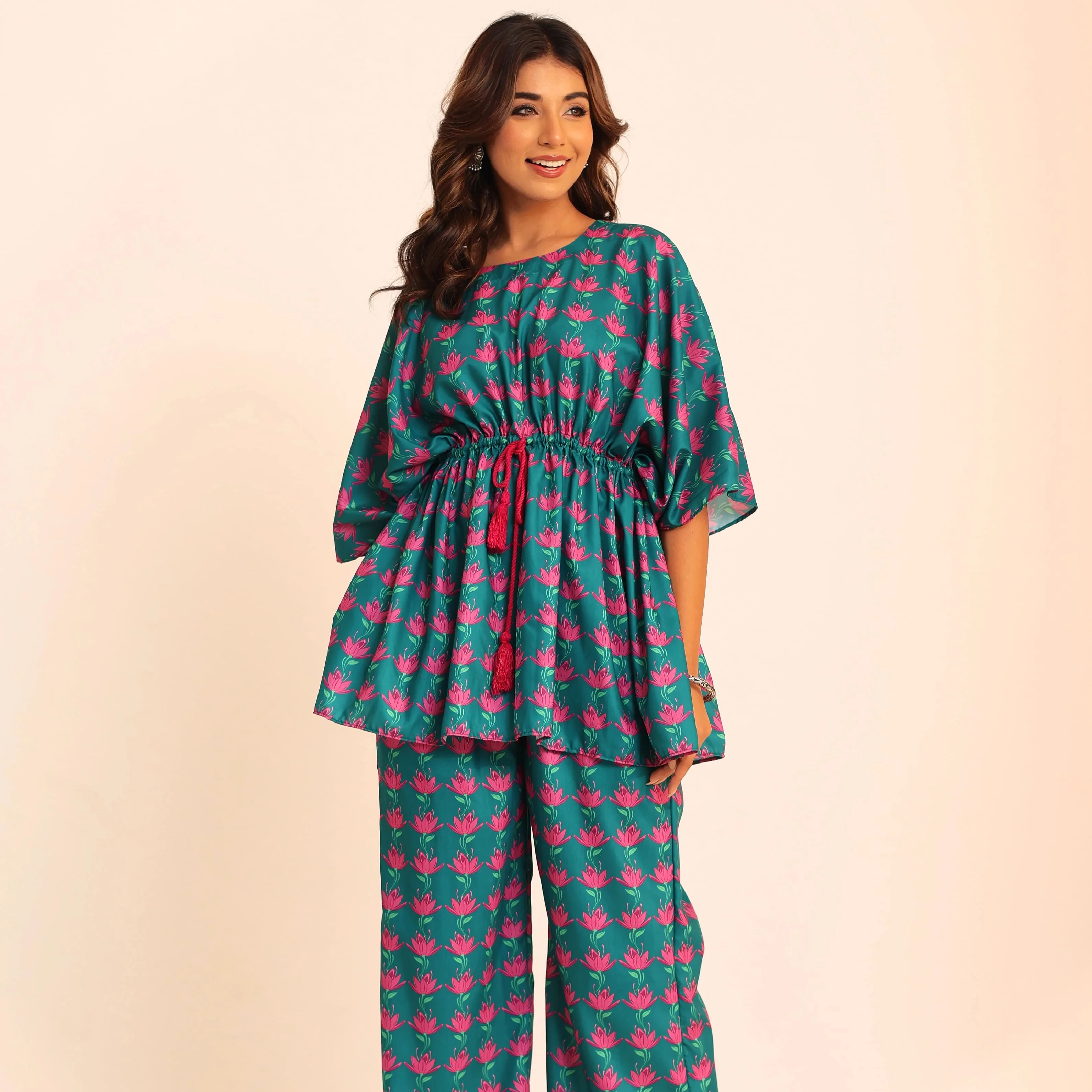 The Meticulously Designed Top And Pant Combination Complete With A Stylish Waist Tie, Offers A Perfect Blend Of Fashion