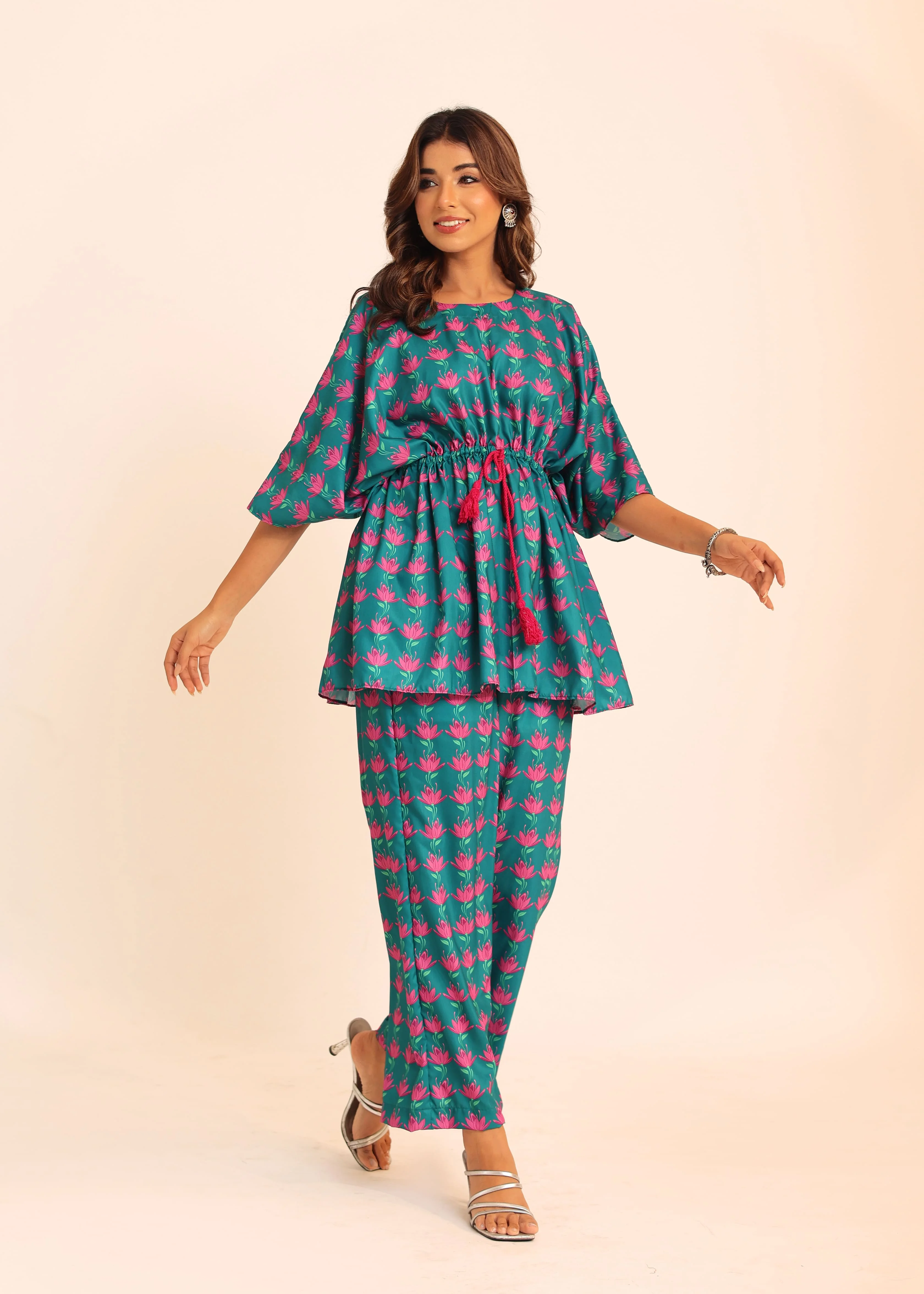 The Meticulously Designed Top And Pant Combination Complete With A Stylish Waist Tie, Offers A Perfect Blend Of Fashion