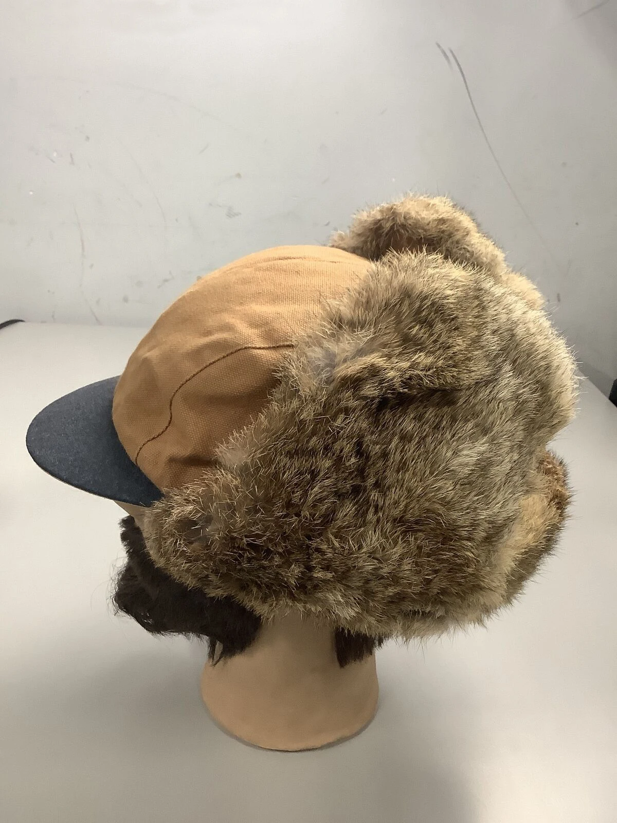 Fully customable wool Russian Aviator cap for men with warm fur lining and adjustable chin strap for winter and skiing