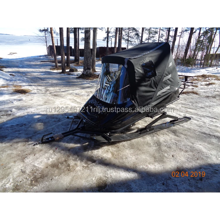 Snow-mobile trailer passenger fiberglass body mounted on steel frame of the suspension system and awning device