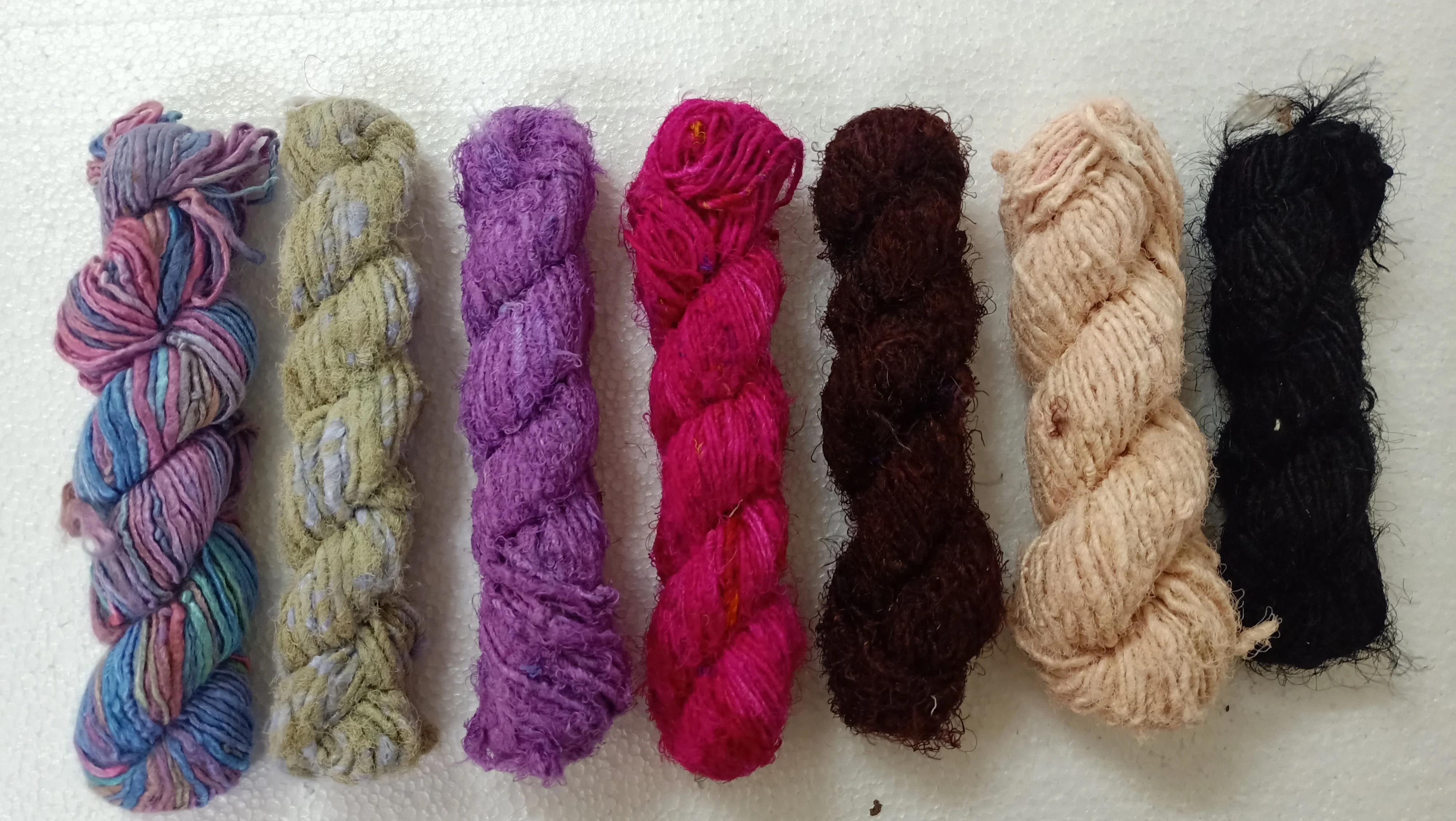 custom made natural and dyed banana an sari silk yarns made from recycled sari silk and banana silk fibers