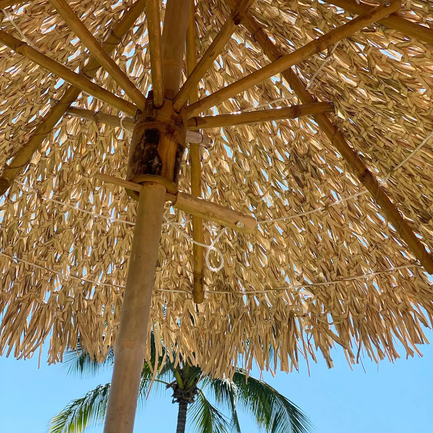 Foldable canopy bamboo thatch natural palm raffia straw umbrella wholesale beach sun parasols from Vietnam