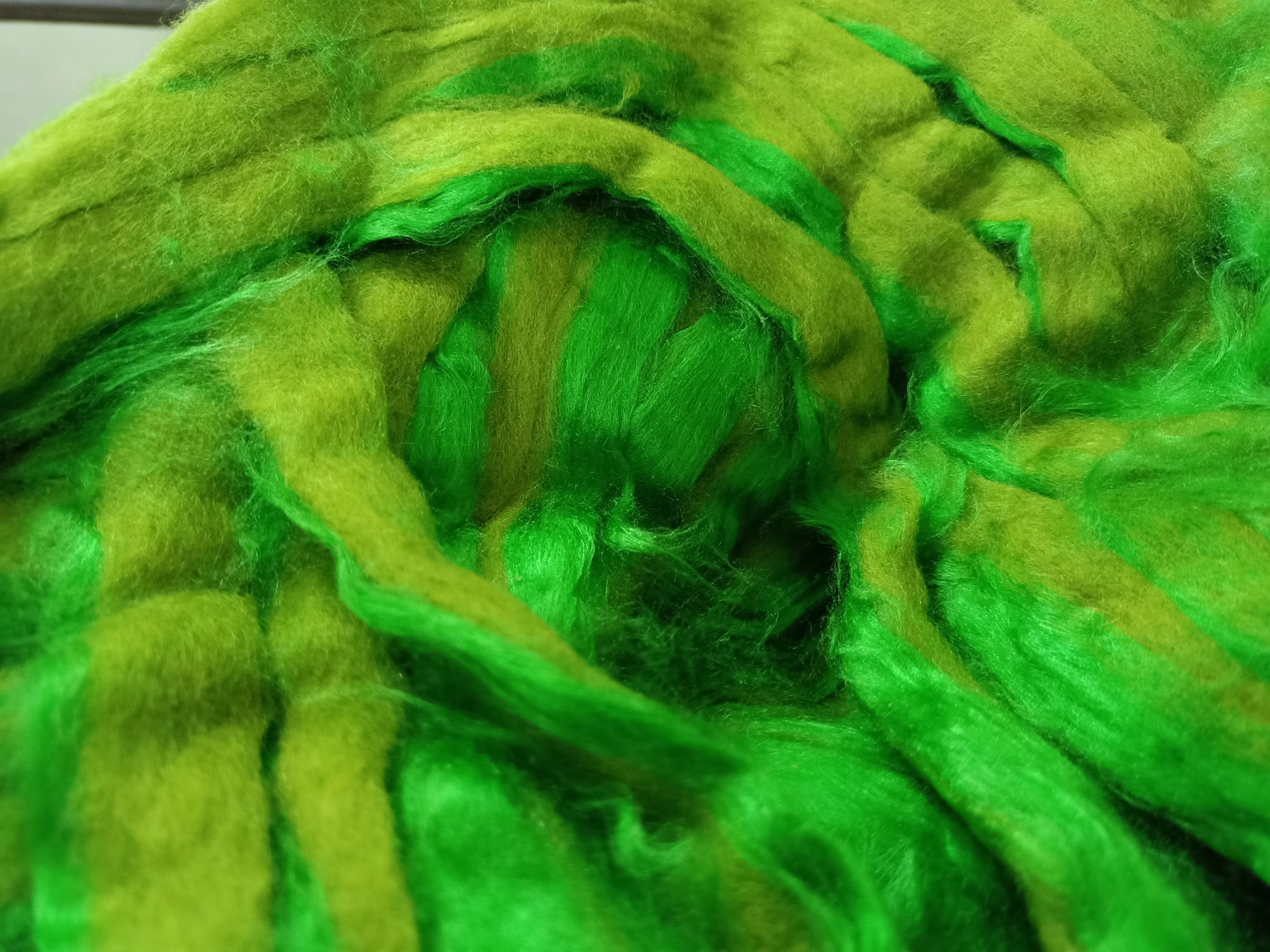 custom made bright green colored sari silk sliver made from the finest mulberry silk roving ideal for textile spinners