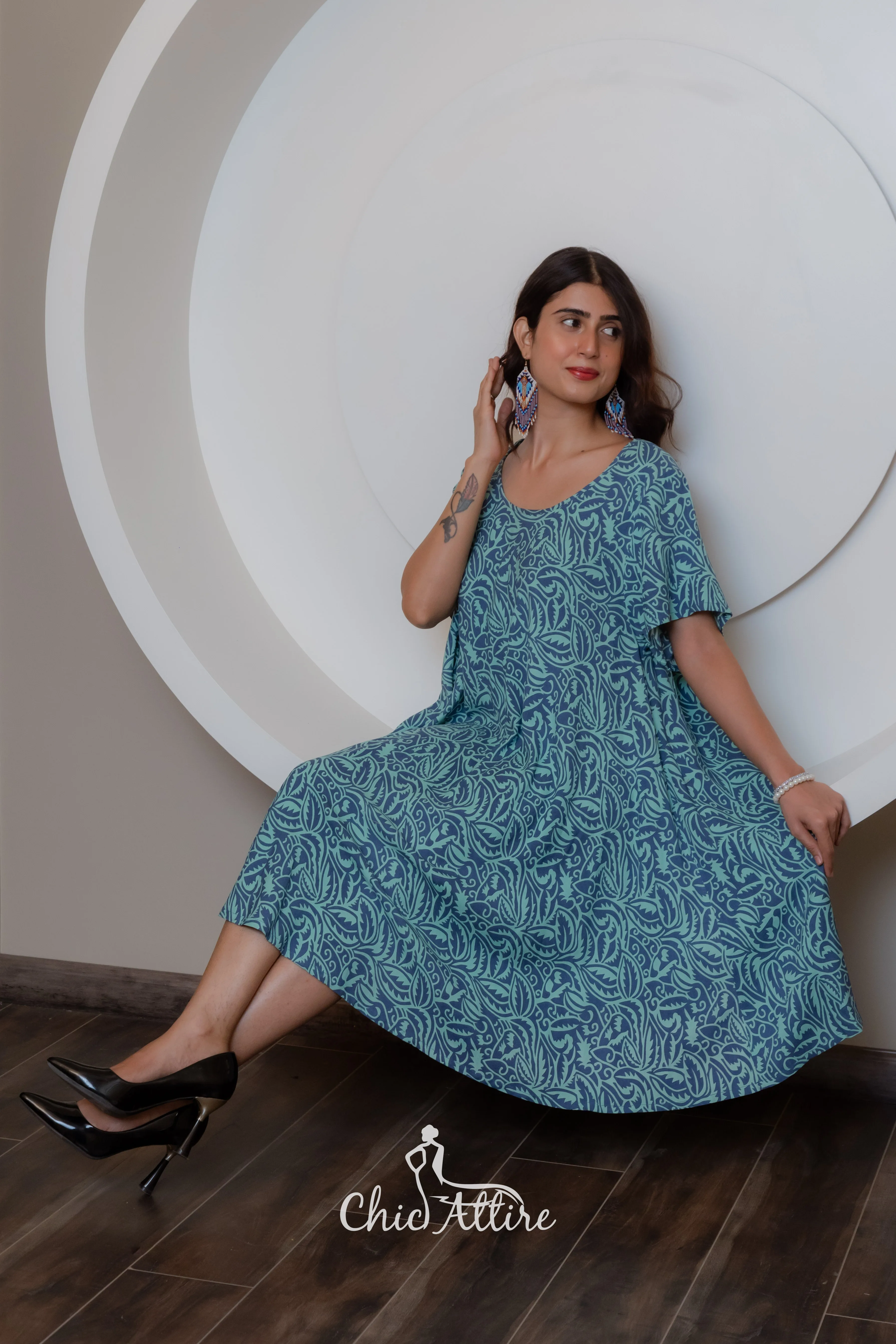 Stylish Teal White Swirl Pattern Midi Dress Ruffled Hemline Short Sleeves Neckline Comfortable Light Flowy Fabric Casual Summer
