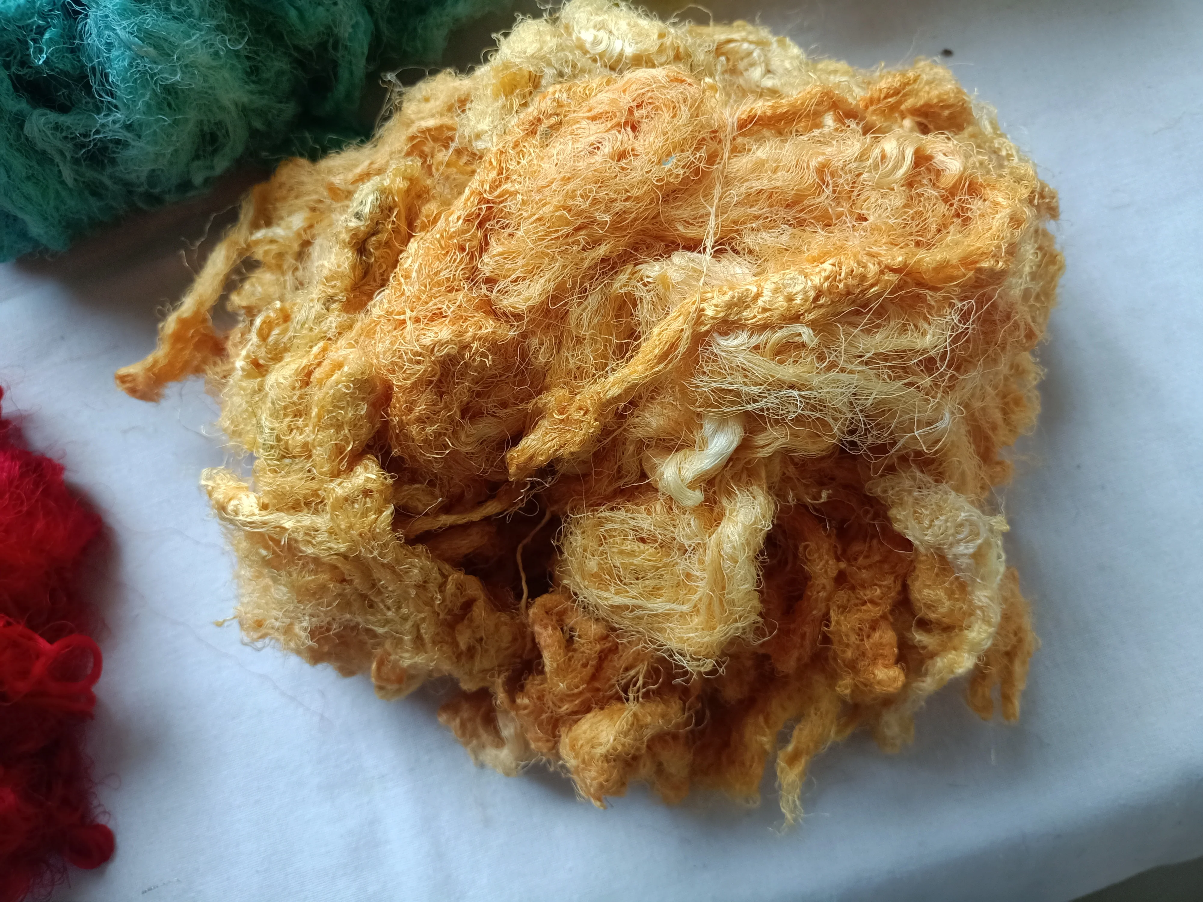 Custom made sari silk waste fiber dyed in custom dyed colors suitable for yarn and fiber stores ideal for resale in blue colour