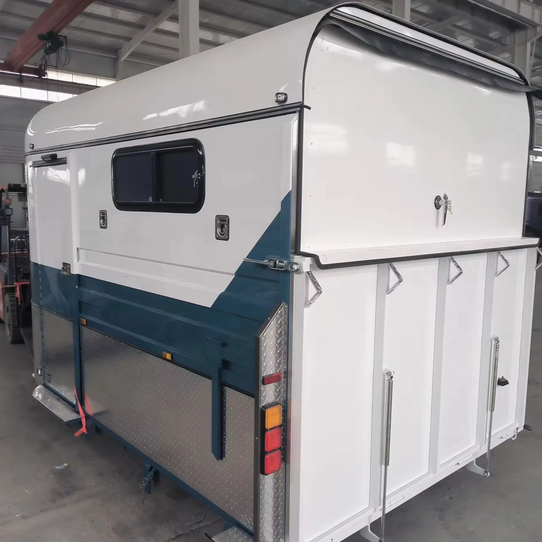 2 horses straight load trailer tyre in front of trailer