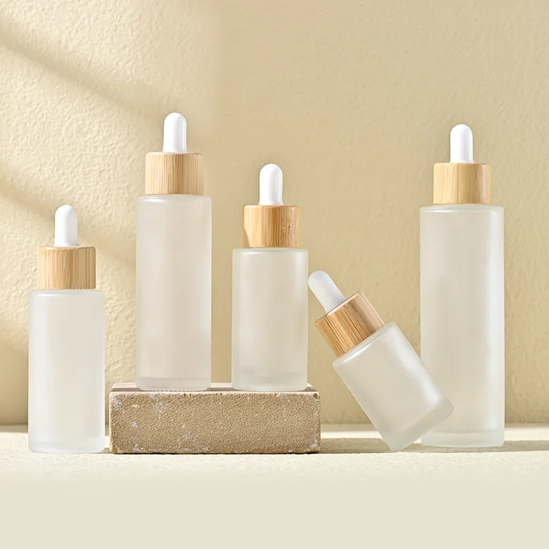 Custom Logo Printed Frost Glass Bottle with Flat Shoulder Serum Empty Clear Dropper Cylinder Shape 15ml 30ml 100ml Capabilities