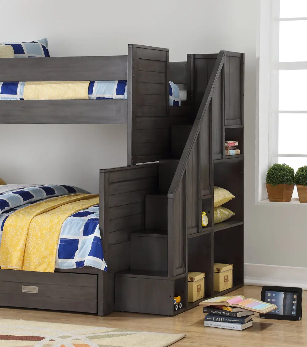 The Dylan bunk beds with stairs feature 6 open-concept bookshelves on the end and manages to retain a classic look