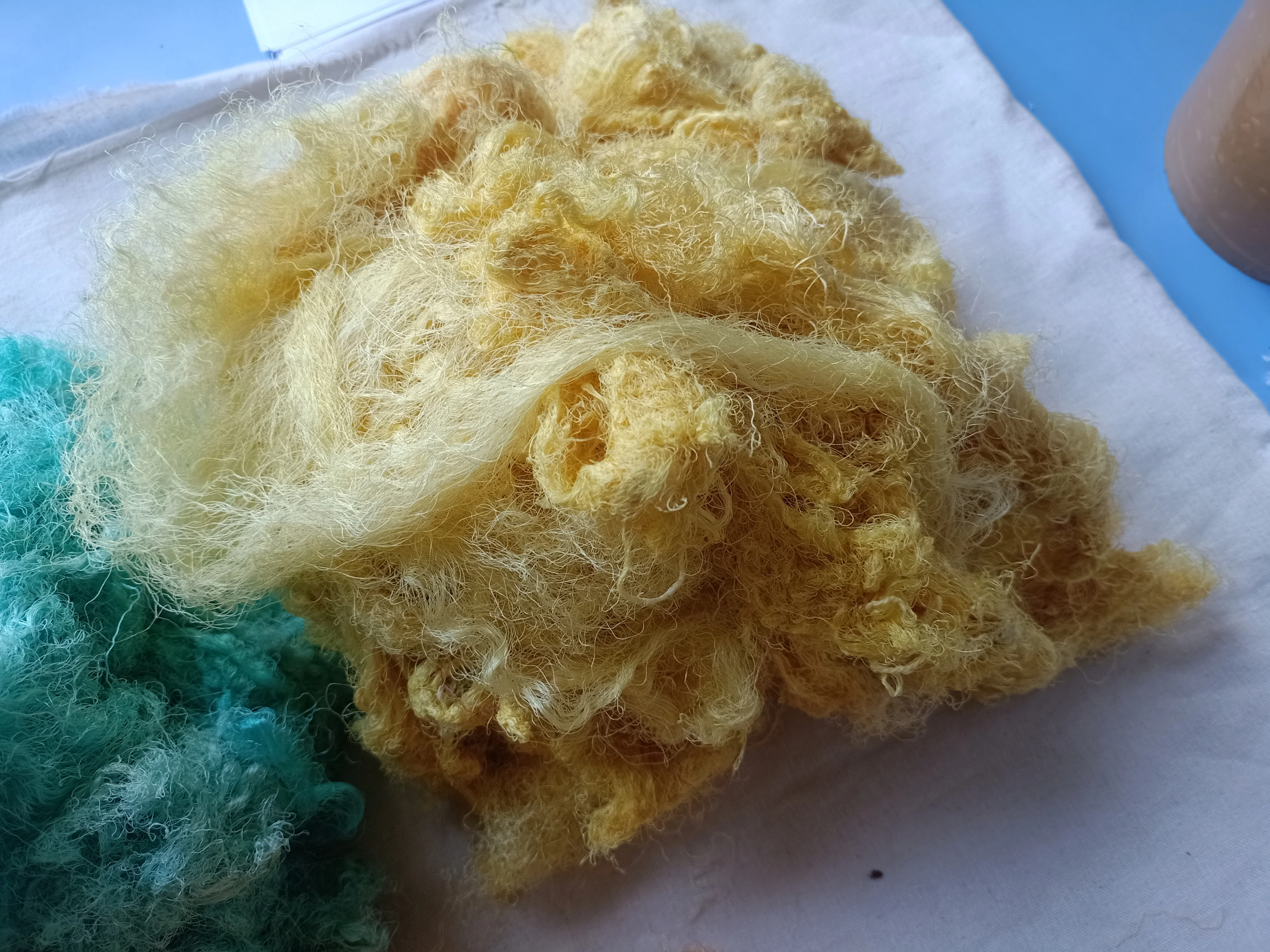 Custom made sari silk waste fiber dyed in custom dyed colors suitable for yarn and fiber stores ideal for resale in blue colour