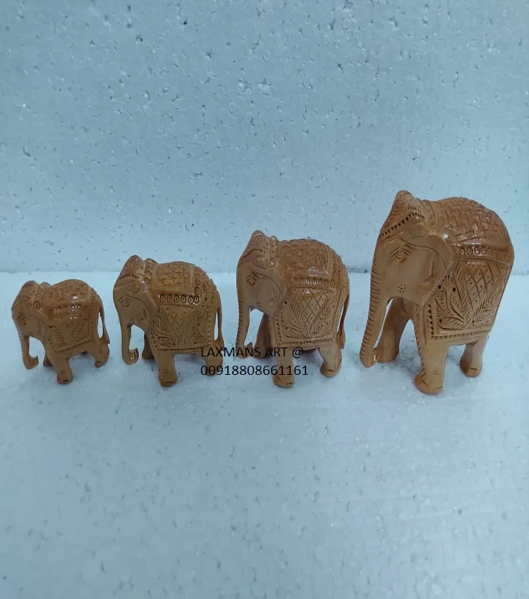 wooden carved elephant statues set 4 pcs elephant set wooden decorative elehphant statue set from india wooden elephant