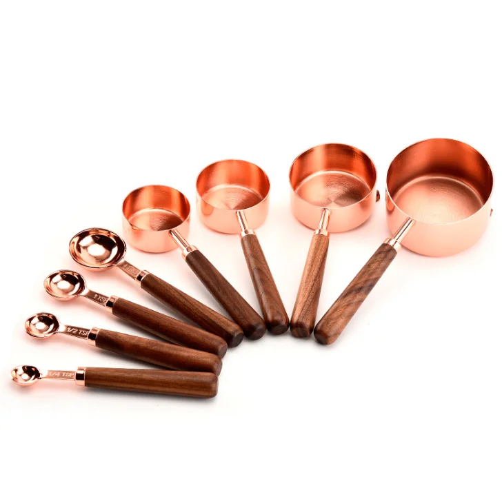 
8 piece copper plated measuring cups and measuring spoons set with wooden handle 