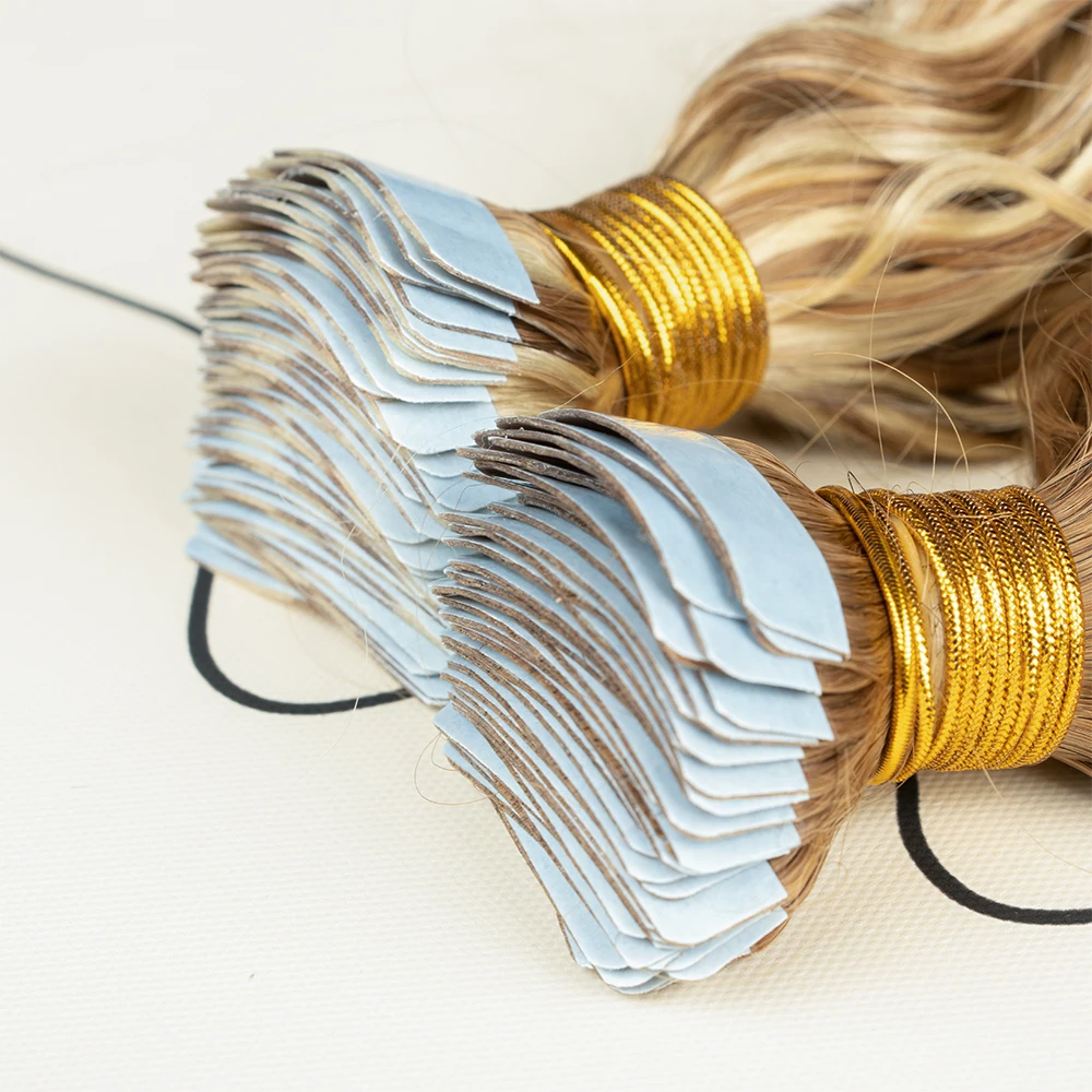 Hot selling natural raw Indian hair tape in human hair 100% natural raw curly hair water wave tape ins