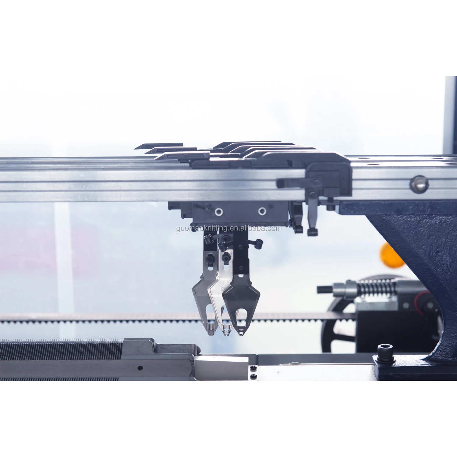 Economical single system computerized flat knitting machine