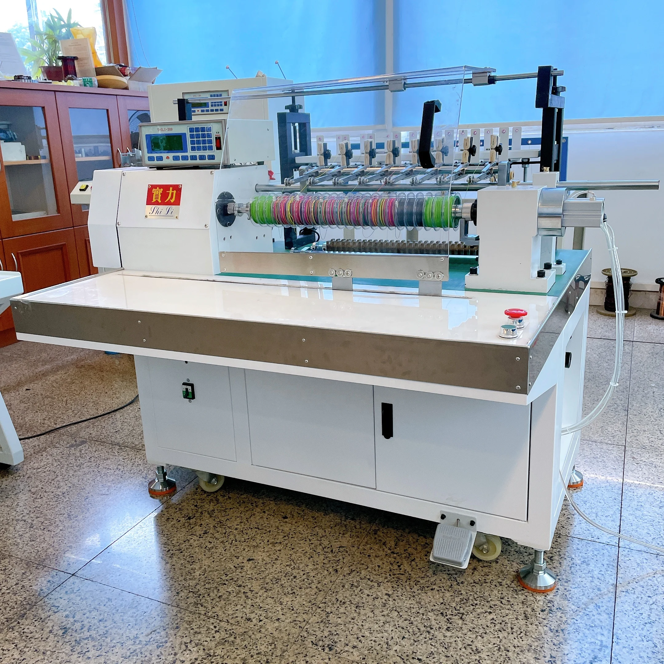 Eight spindle high production fishing line winding machine