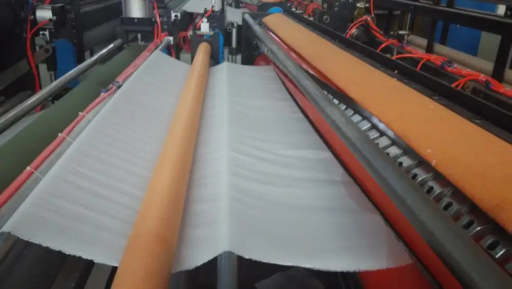 Automatic high speed rewinding embossing toilet tissue roll paper machine