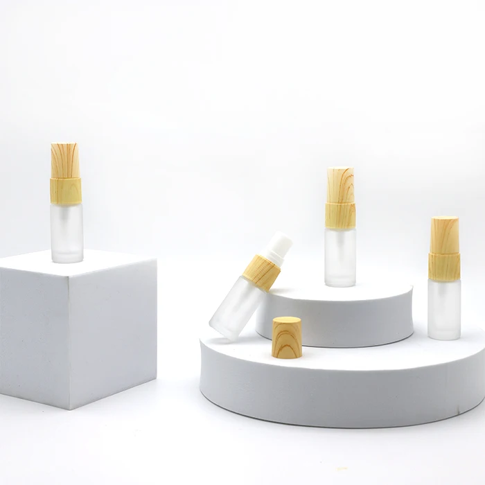small glass 5ml round cosmetic frosted spray perfume oil bottle sample essential oil bottle with Wood grain cap in stock