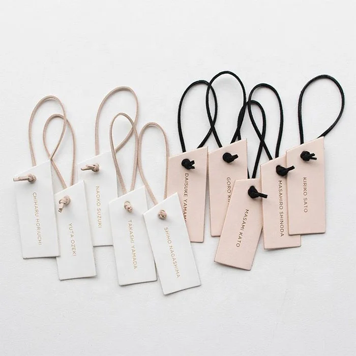 Best Selling transparent plastic hang tags custom embossed hang tag private label hang tags