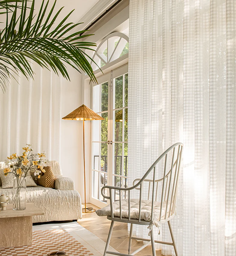 Owenie rod pocket window curtains in a linen blend features a variegated horizontal Slub yarn.