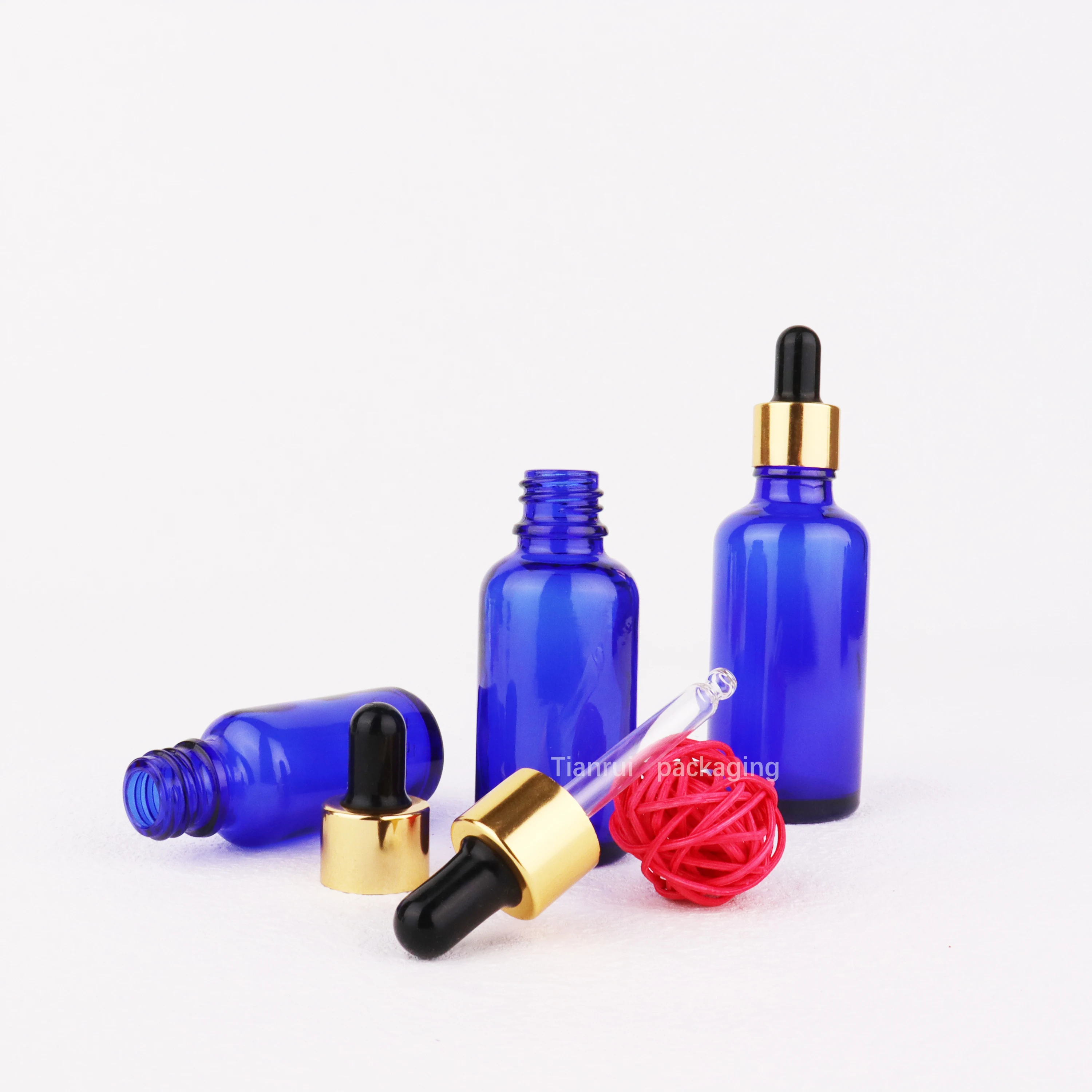 Low MOQ Essential Oil Product Container Colored Glass Dropper Bottles 5 10 15 20 30 50 100ml 2 oz Blue Serum Bottles