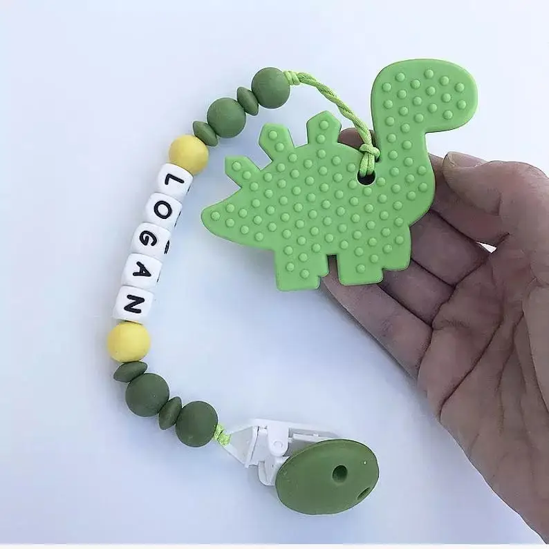 amazon top seller 2019 baby silicone teether dinosaur shape custom bpa free LFGB reports