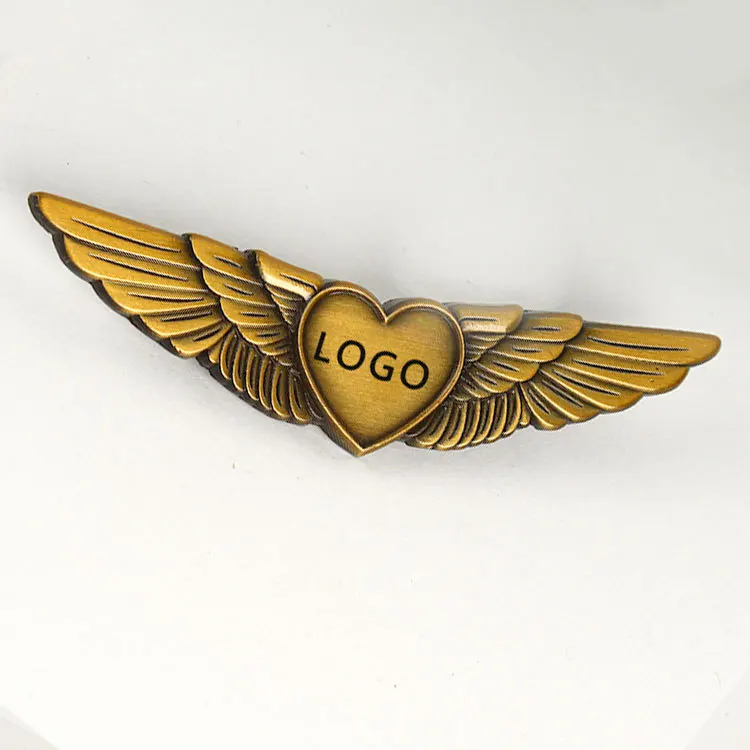 Heart shape logo metal zinc alloy embossed 3d gold plated pilot wings shape aviation airline badges for souvenir