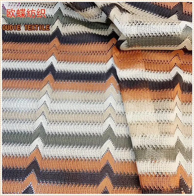 The manufacturer directly provides polyester yarn dyed blended polyester bright silk mesh knitted clothing fabric
