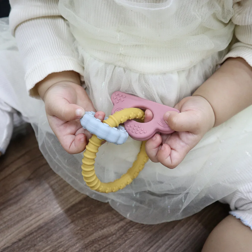 3 In 1 New Arrival Food Grade Silicone Teether Rattles Sensory Chewing Toys Bpa Free Silicone Infant Donut Teething Ring