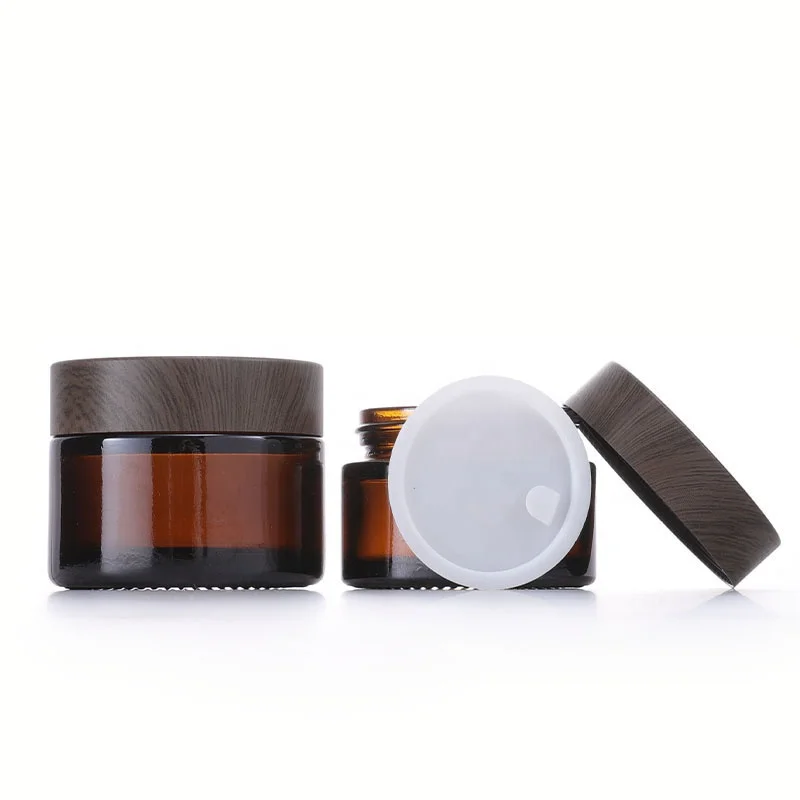 5g 10g 30g 50g 100g 4oz Custom Glass Eye Face Body Empty Cream Cosmetic Amber Jar With Black Dare Wood Lid Cheap prices