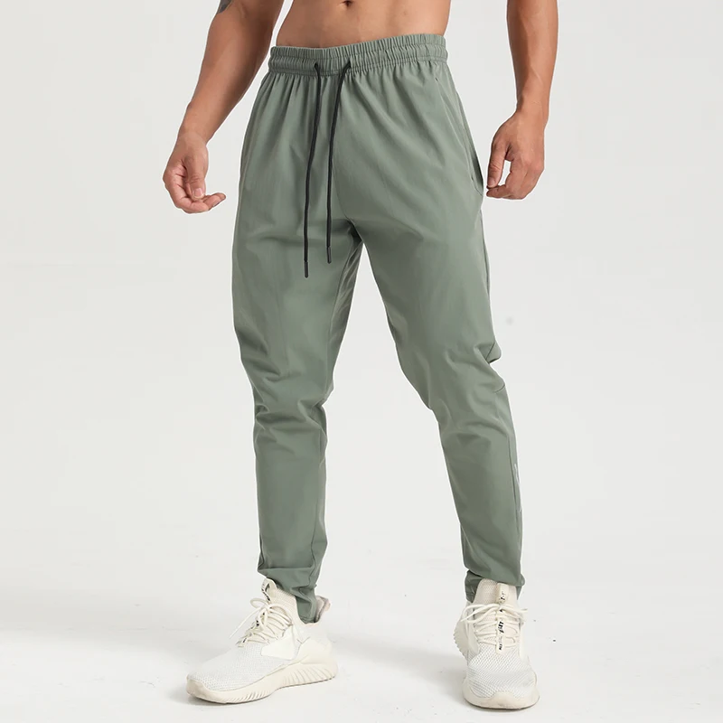 Factory direct sales four solid color blank trousers with drawstring texture quick dry fabric zipper pocket sweatpants men