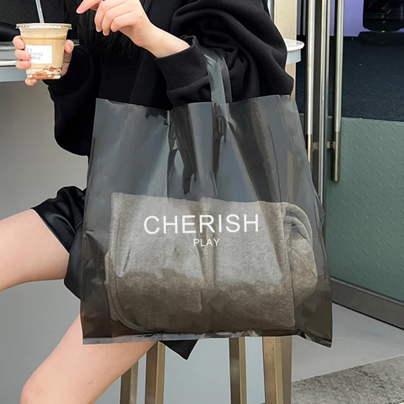 Wholesale customizable LOGO black blue orange green clothing carrying bag transparent high-grade portable shopping plastic bags