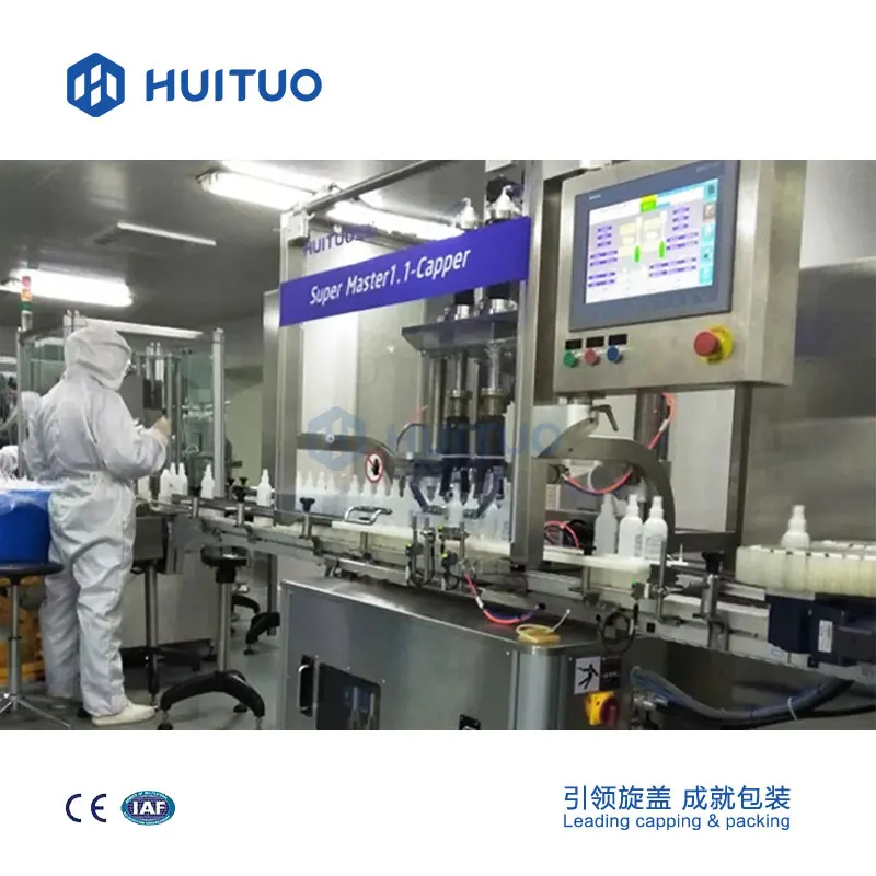 Automatic liquid bottle capping machine for detergent, hand sanitizing gel and soap.