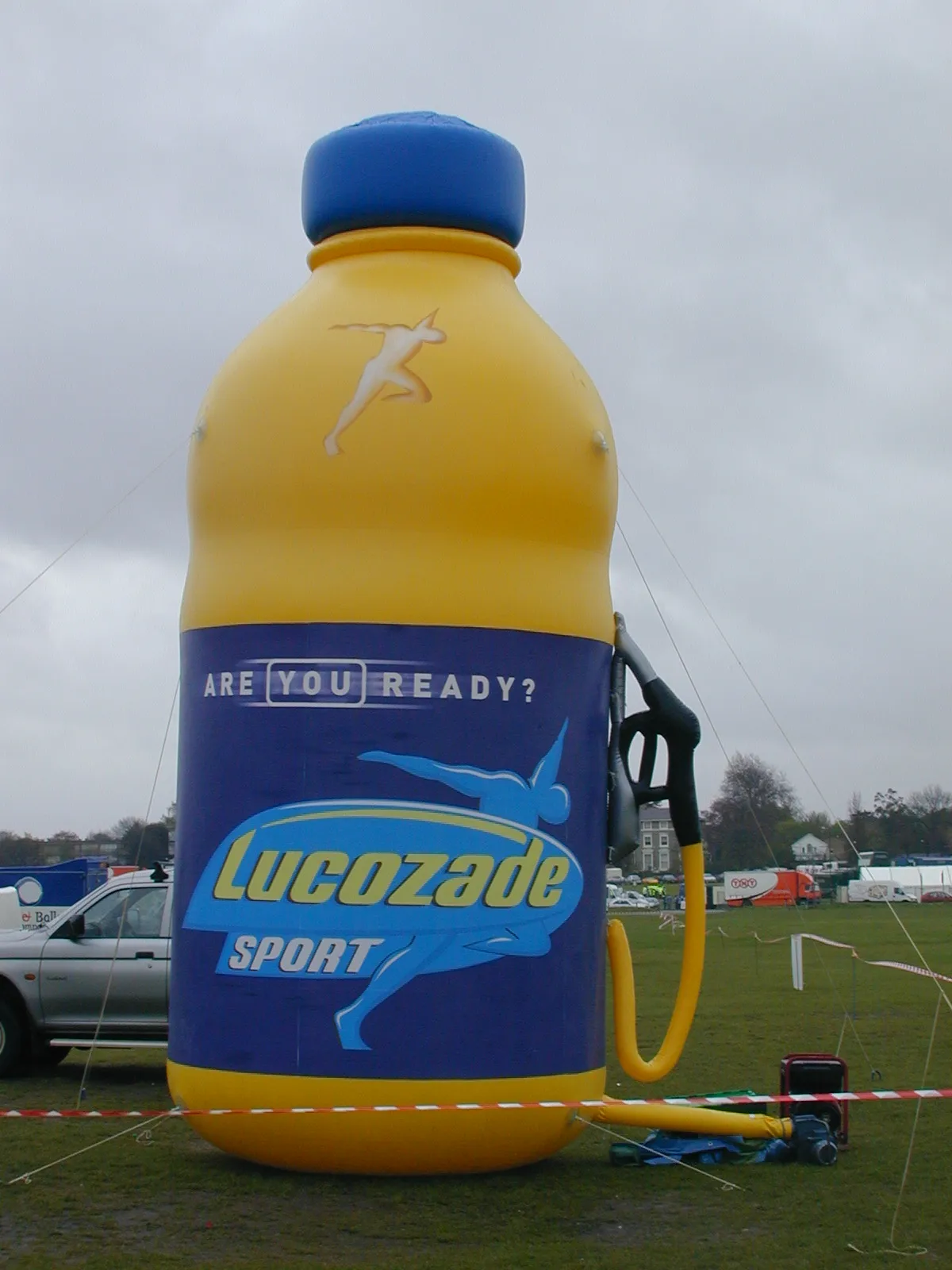 Printed 7m high 14 m long giant inflatable football player helium balloon in a kicking pose for parades
