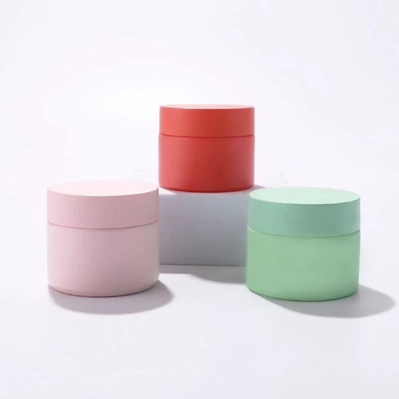 New design 50g customized color frosted cosmetic white ceramic jar packing with plastic cap for face cream eye cream for sale