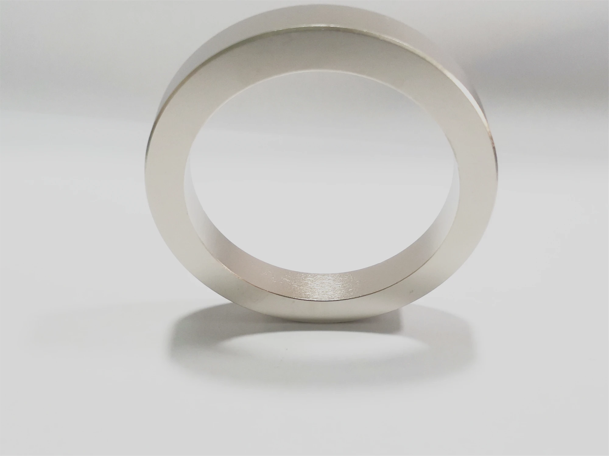 Radially oriented annular sintered neodymium rare earth permanent magnet ring magnet