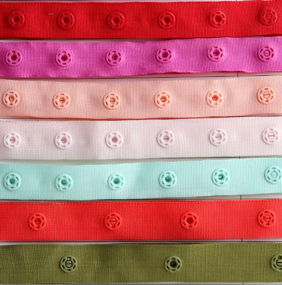 Wholesales plastic snap button fasteners on a tape of polyester fabric for baby clothing more size