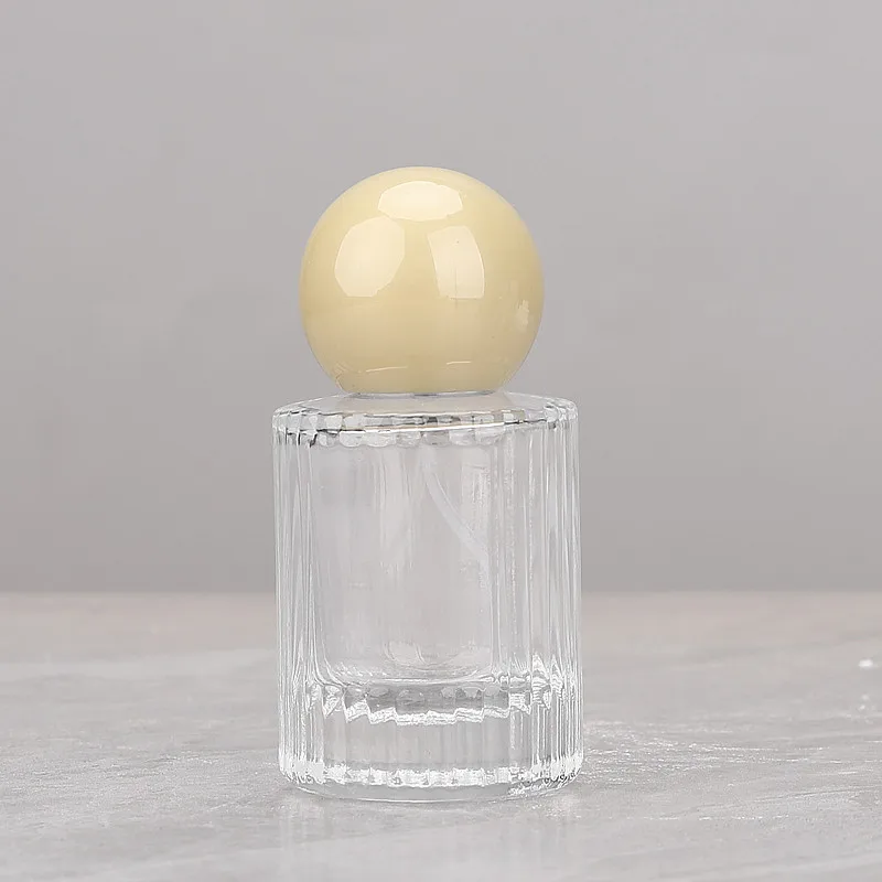 Wholesale 30ml Cylinder Fragrance Glass Bottle 50ml Transparent Vertical Line Round Perfume Spray Bottle with Round Ball Cap