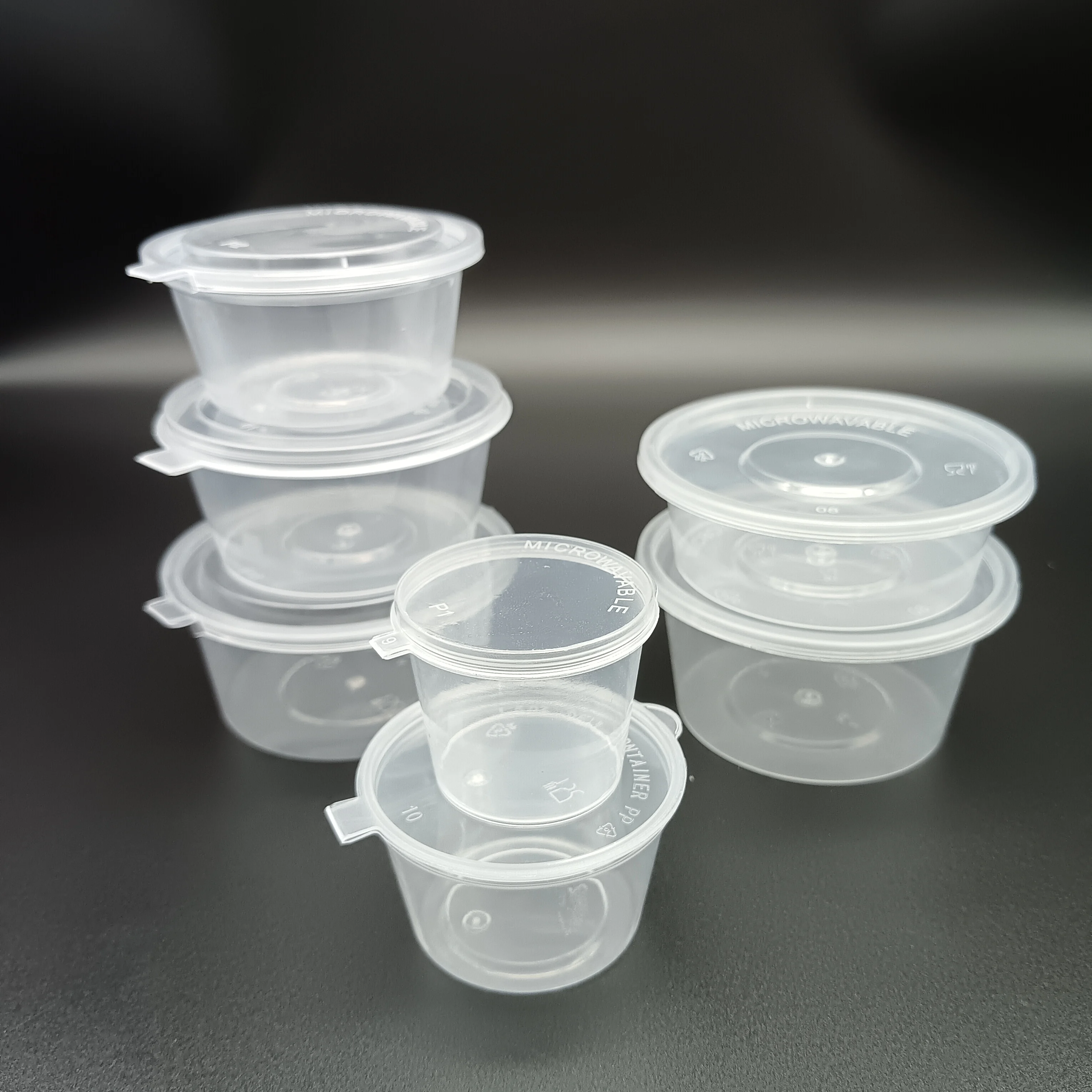 Small capacity one-piece 1 oz disposable plastic sauce cup with lid