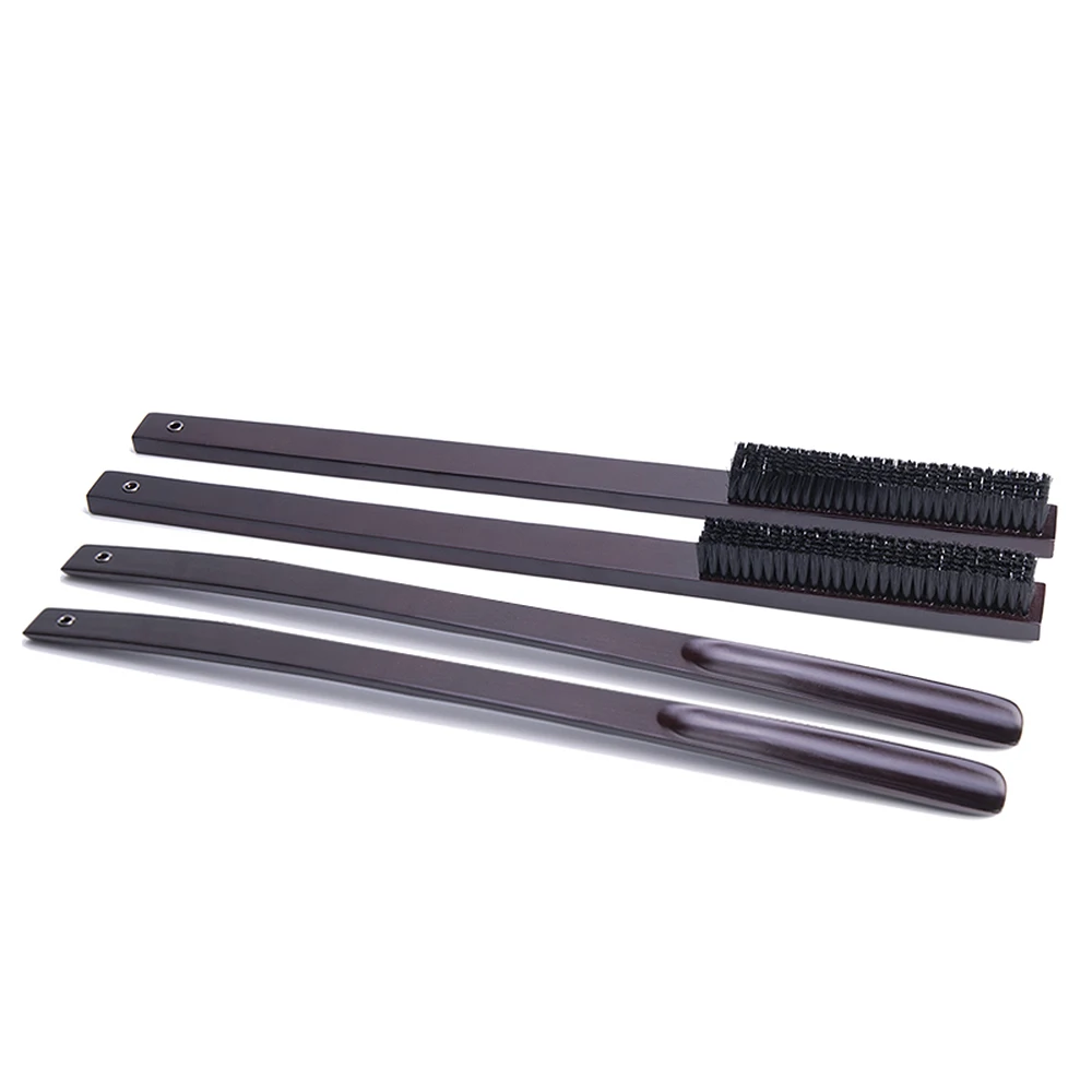 Длинный металлический обувной рог с кожаной ручкой