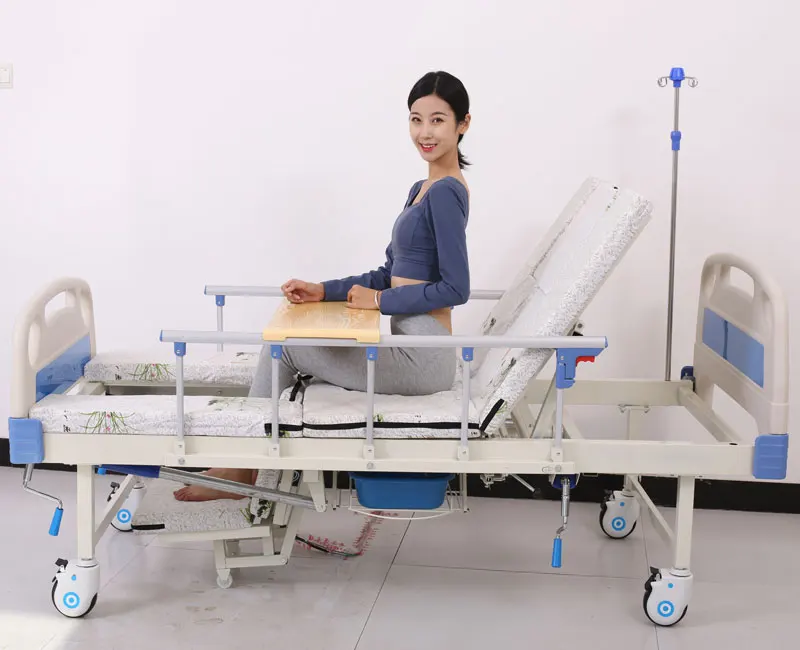 Manufacture cheap backrest semi bending homecare functions manual nursing bed with washbasin potty hole