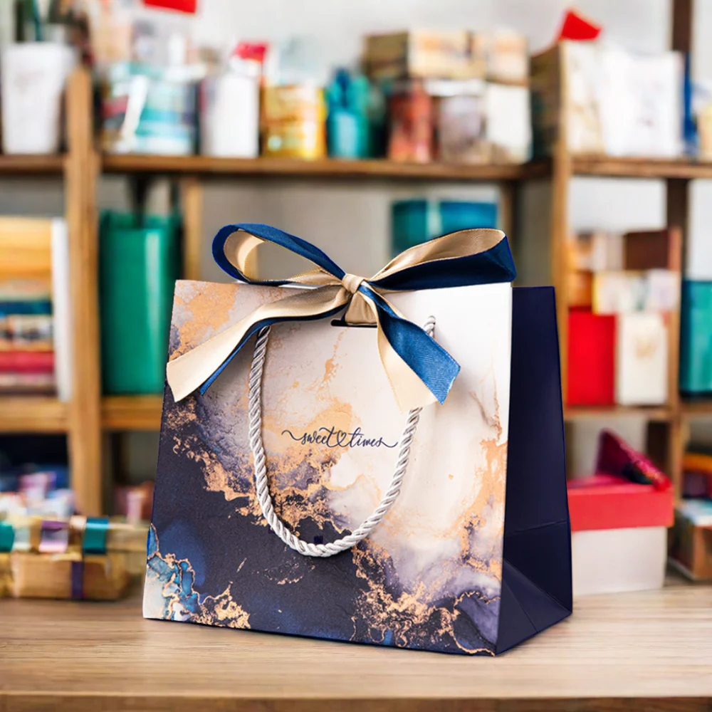 Wholesale Luxury Bulk Square Bottom White Cardboard Offset Printing Clothing Jewelry Paper Gift Bags with Ribbon Bow and Handles