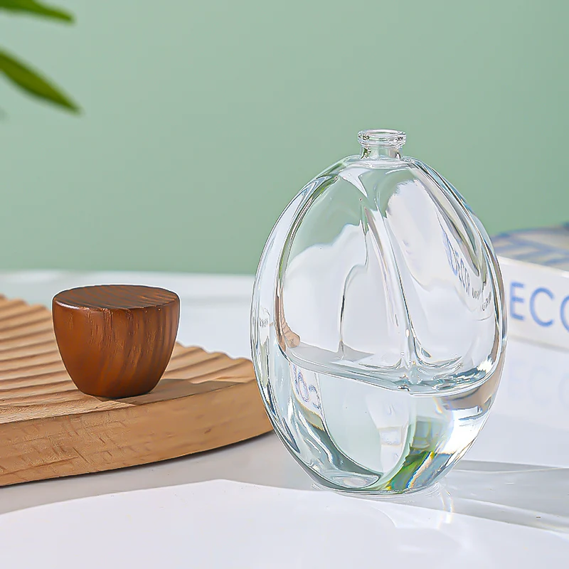 Luxury Custom Transparent Oval Perfume Bottle 50ML Thick Bottom Cologne Water Bottle Wooden Cover Perfume Spray