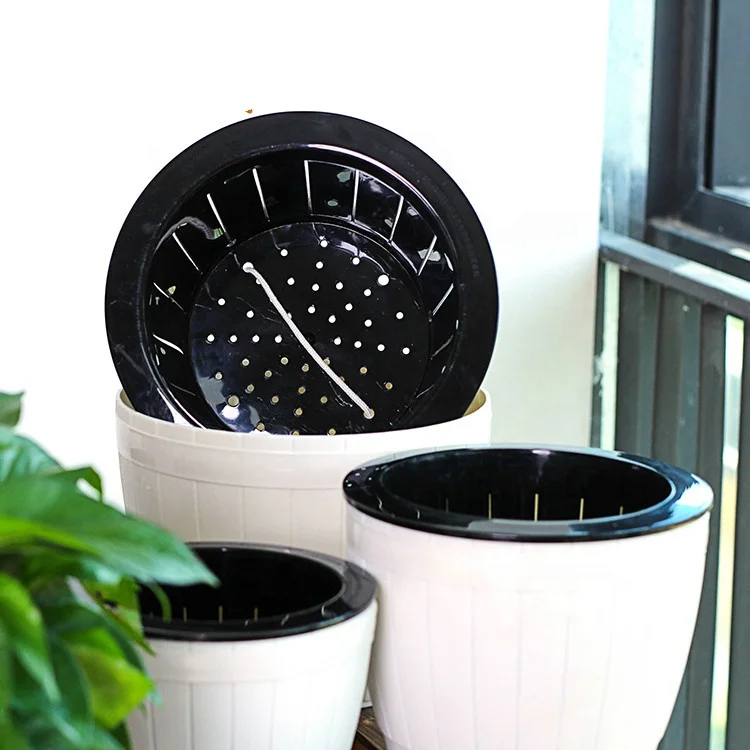 Self watering plastic flower plant pot for indoor