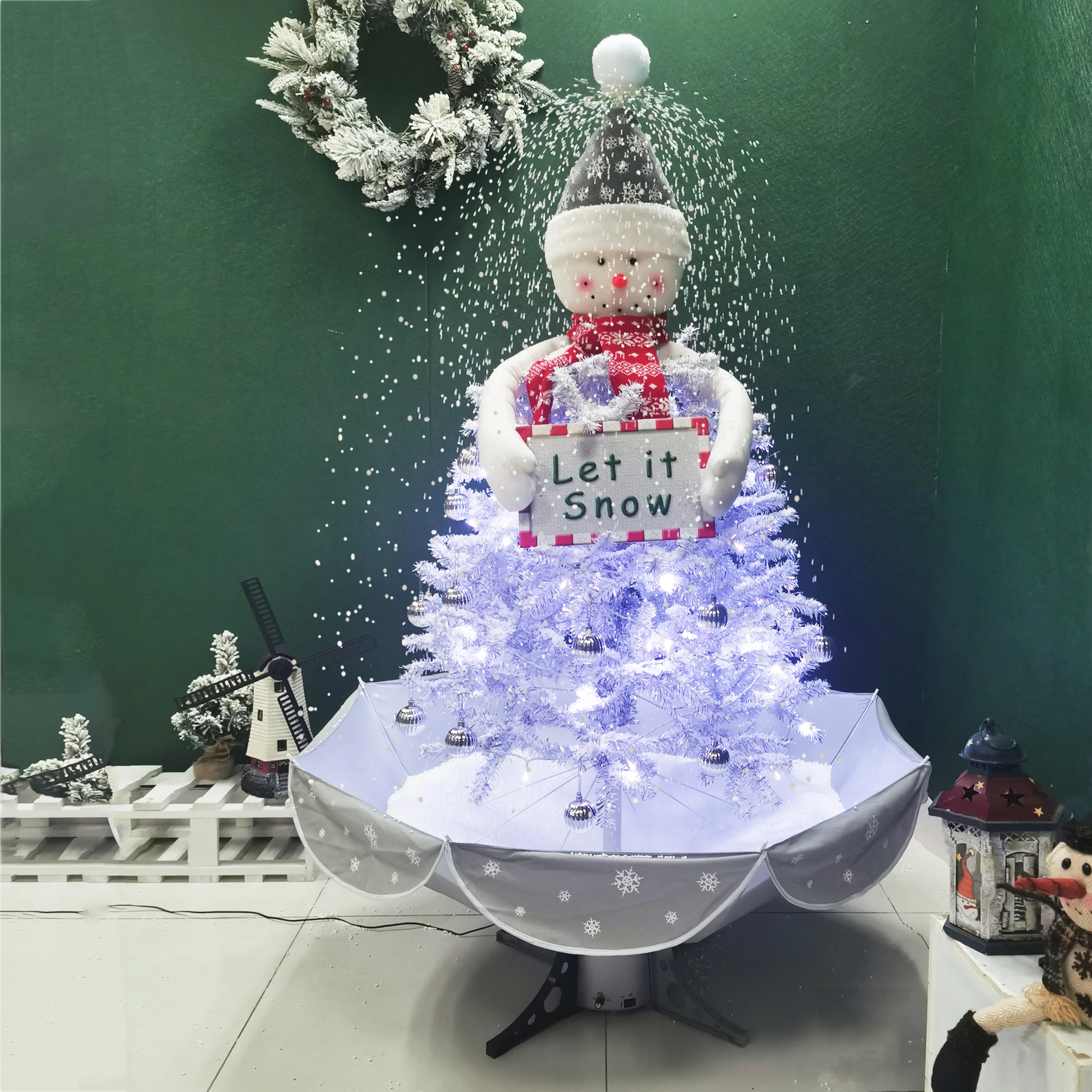 pre lit snowing snowman on the silver Christmas tree with card